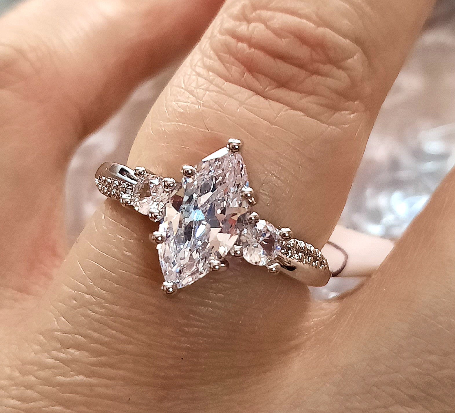 Rings This is a Exquisite Marquise Moissanite Ring in Size 8 with a size Adjuster