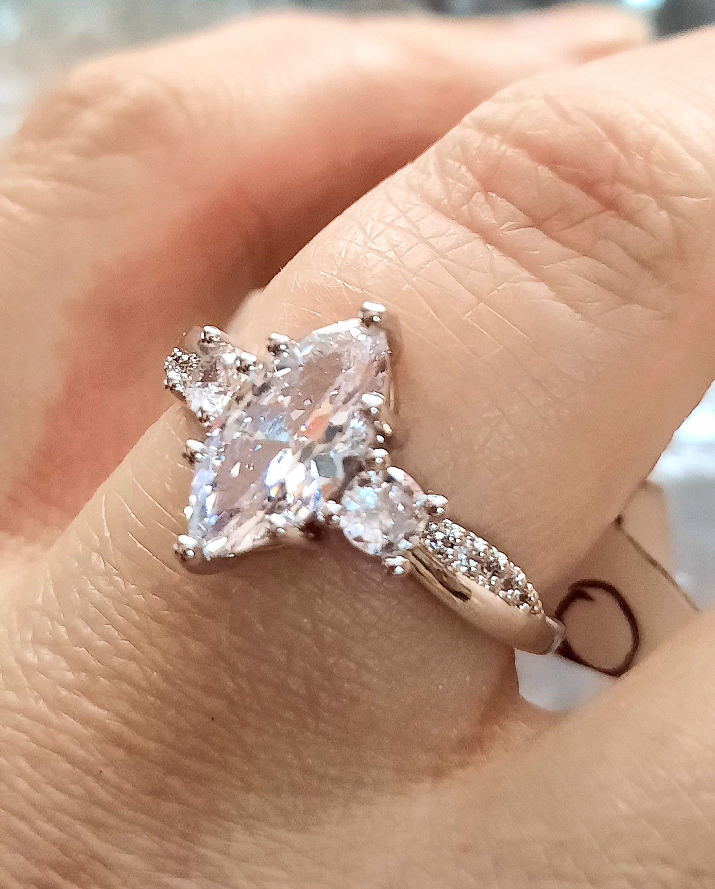 Rings This is a Exquisite Marquise Moissanite Ring in Size 8 with a size Adjuster