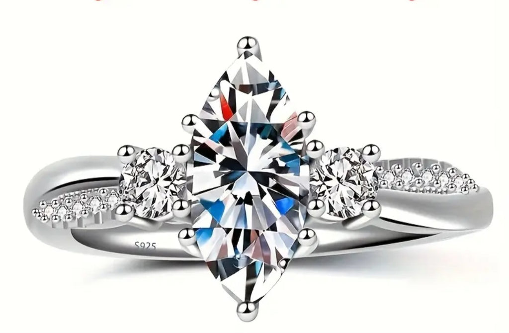 Rings This is a Exquisite Marquise Moissanite Ring in Size 8 with a size Adjuster
