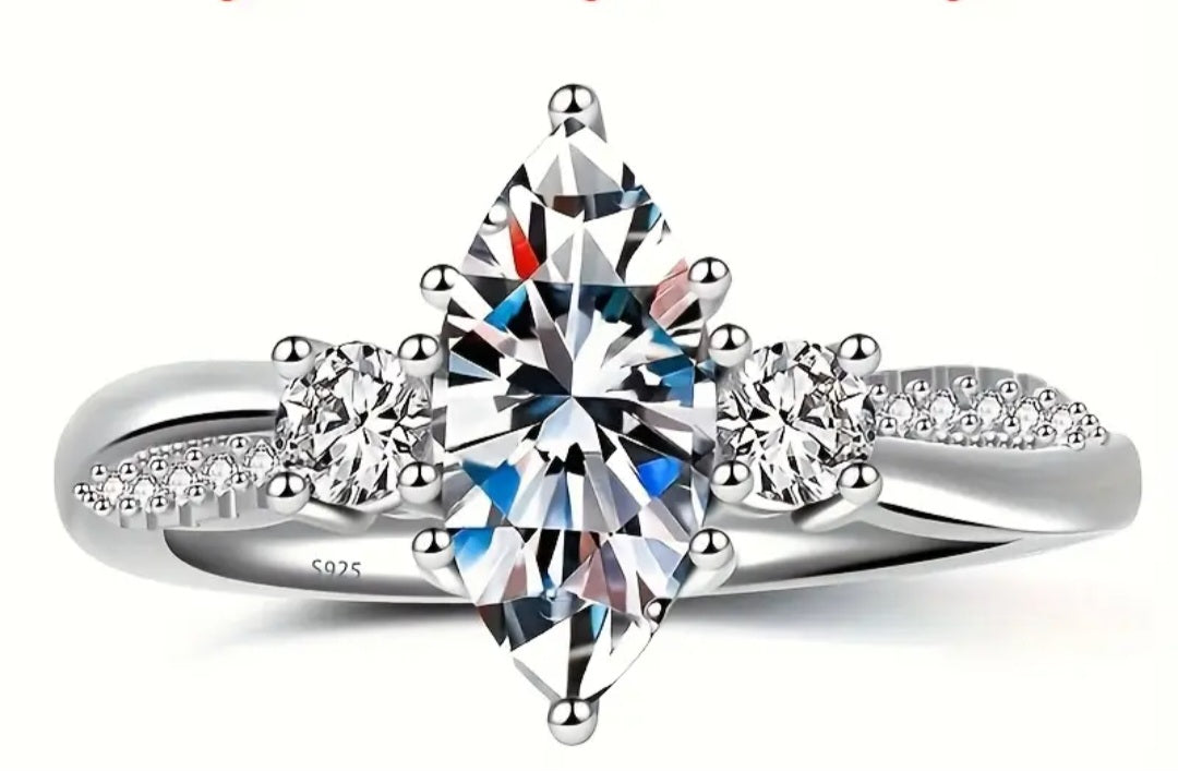 Rings This is a Exquisite Marquise Moissanite Ring in Size 8 with a size Adjuster